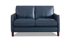 a blue leather loveseat on a white background