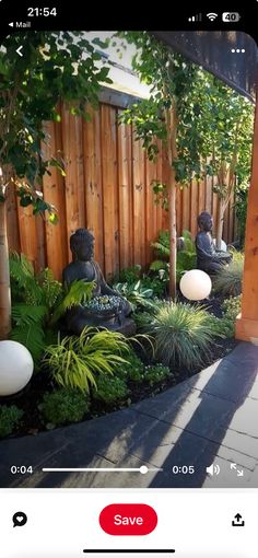 an image of a garden with buddha statues in the center and plants growing on either side