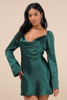 You'll be destined for fabulousness when you slip into the Lulus Sensational Fate Emerald Green Satin Cowl Neck Mini Dress for a night of drinks and dancing! Luxe stretch-woven satin shapes this effortlessly chic dress that features a flirty cowl neckline and long sleeves with elastic at the shoulders and unique flaring cuffs. The figure-skimming silhouette continues down to a subtle A-line skirt that ends at a cute mini hem. Hidden back zipper/clasp. Fit: This garment fits true to size. Length: Stretch Bias Cut Dress For Night Out, Satin V-neck Mini Dress For Dinner, Bias Cut Dress For Date Night, Flirty Satin Dress For Party Season Night Out, Fitted Bias Cut Mini Dress For Date Night, Fitted Satin V-neck Mini Dress, Flirty Fitted Satin Dress For Date Night, Stretch Bias Cut Party Dress, Glamorous Fitted Satin Party Dress