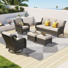 an outdoor living area with furniture and plants