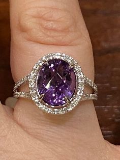 14K White Gold Diamond and Amethyst  Oval Amethyst total carat weight 3.10carats.  Diamonds VS1 G/H color Free Ring Re-sizing upon request (Up to US Size 11) Luxury Dazzling Round Amethyst Ring, Luxury Octagon Amethyst Ring For Anniversary, Luxury Faceted Amethyst Wedding Ring, Luxury Purple Gemstones With Halo Setting, Luxury Purple Platinum Rings, Formal Purple Brilliant Cut Gemstones, Luxury Platinum Amethyst Ring With Brilliant Cut, Dazzling Amethyst Ring For Formal Occasions, Luxury Purple Jewelry With Center Stone