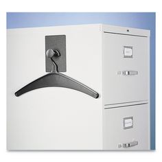 a white filing cabinet with two drawers and a hanger on the door knobs