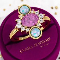 Add a touch of mystique to your ensemble with our Purple Garnet Natural Evil Eye Vintage Statement Ring. Crafted with opal and accented with a lab-grown CVD diamond, this handmade jewelry piece is truly one of a kind. Perfect as a personalized gift for her, it exudes charm and elegance. Elevate your style with this unique treasure from our Etsy store. 𝐅𝐞𝐚𝐭𝐮𝐫𝐞𝐬: * 𝐌𝐚𝐝𝐞 𝐭𝐨 𝐎𝐫𝐝𝐞𝐫 * 𝐌𝐞𝐭𝐚𝐥: 𝟏𝟒𝐊 𝐆𝐨𝐥𝐝 | 𝟏𝟖𝐊 𝐆𝐨𝐥𝐝 | 𝟗𝟓𝟎 𝐏𝐥𝐚𝐭𝐢𝐧𝐮𝐦 * 𝐁𝐚𝐧𝐝 𝐂𝐨𝐥𝐨𝐫𝐬: Rose Gold, Yellow Gold & White Gold * 𝐁𝐚𝐧𝐝 𝐖𝐢𝐝𝐭𝐡: 2.00 MM * 𝐁𝐚𝐧𝐝 𝐓𝐡𝐢𝐜𝐤𝐧𝐞𝐬𝐬: 1.50 MM 𝐂𝐞𝐧𝐭𝐞𝐫 𝐬𝐭𝐨𝐧𝐞: * 𝐒𝐭𝐨𝐧𝐞 - Purple Garnet (Natural) * 𝐒𝐡𝐚𝐩𝐞 - Oval Cut * 𝐂𝐚𝐫𝐚𝐭 𝐖𝐞𝐢𝐠𝐡𝐭 - 1.50 Carats * 𝐏𝐢𝐞𝐜𝐞𝐬 - 1 Piece * 𝐂𝐨𝐥𝐨𝐫 - Vivid Purple * 𝐂𝐥𝐚𝐫𝐢𝐭? Evil Eye Vintage, Purple Garnet, Stacked Wedding Rings, Cvd Diamond, Engagement Rings Oval, Personalized Gifts For Her, White Gold Band, Multi Stone Ring, Color Ring