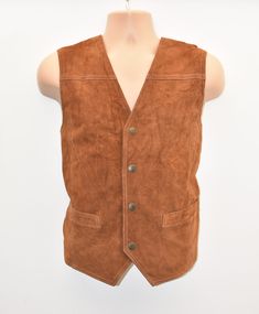 "Vintage Brown Real Leather Textile SPORTIVE Western Biker Vest Men's Waistcoat  Size XL ############### Exact Material: Genuine Leather Garment Care: Dry-clean Only Chest Size - 46 in ###############  Lying flat on the floor inches and cm:  Armpit to armpit - 23.25\" (59 cm)  Shoulder to shoulder - 16\" (40.7 cm)   Full length - 24\" (61 cm)  Weight approx - 400 gr The waistcoat is good condition with vintage smell and some marks on the back. Please pay attention to all pictures. *Please note that most of my items are vintage and has therefore been previously used unless stated otherwise. Vintage items will have some degree of wear, bobbling or a musty smell. Please take this into consideration when purchasing. If the item has any defects these will be stated in the listing and I do my ve Casual Sleeveless Outerwear For Biker Events, Outdoor Leather Vest With Pockets, Fall Outdoor Biker Vest, Fall Biker Vest For Outdoor, Fitted Brown Outerwear For Outdoor Activities, Winter Biker Events Vest Outerwear, Rugged Outdoor Winter Vest, Rugged Winter Vest For Outdoor Activities, Brown Rugged Winter Vest