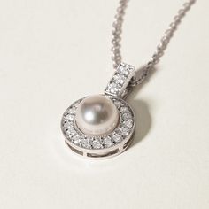 Experience Timeless Elegance with Akoya Pearls Material: Akoya Pearl, 18K white gold and diamond (S925 Silver Chain) Akoya pearl saltwater cultured pearl 1 pearl 6.5-7.0mm 21 diamonds about 0.315 carats in total Size of Pendant: 12.0*18.5 mm Handpicked of every pearl, only the top 1% of pearls are selected Handcrafted Lifetime warranty Classic Platinum Necklace For Wedding, Classic Akoya Pearl Diamond Necklace For Anniversary, Luxury Pearl Charm Round Jewelry, Luxury Round Pearl Charm Jewelry, Classic White Gold Necklace For Wedding, Classic Round Brilliant Cut Pearl Necklace, Classic Pearl Necklace With Diamond Accents For Anniversary, Classic Diamond Necklace With Pearl Chain For Weddings, Exquisite Pearl Chain Necklace For Anniversary