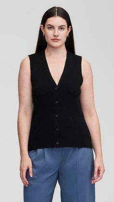 Elevate your workwear with a classic knit rib waistcoat. Designed to be worn as a top on its own or styled over a shirt or blouse, our waistcoat reimagines traditional suiting for the modern working woman. The slim silhouette features an all over ribbed pattern, a fitted v-neck silhouette, and button closure. Wear with relaxed trousers and sneakers for a cozy yet put-together ensemble. Knit Tops With Button Closure For Work, V-neck Knit Vest For Work, Black Knit Sweater Vest For Work, Black Knit Vest For Workwear, Black Knit Vest For Work, Classic Sweater Vest With Button Closure For Work, Classic Black Sweater Vest For Spring, Chic Sweater Vest For Work With Button Closure, V-neck Sweater Vest With Button Closure For Work