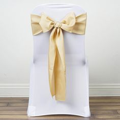 a white chair with a yellow bow on it