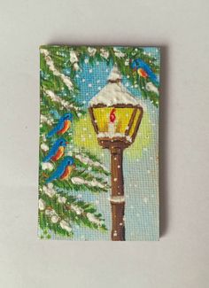 a painting of a street light with birds on it