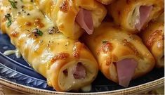 ham and cheese rolls on a blue plate