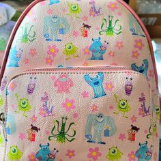 Super Awesome Danielle Nicole Disney Monsters Inc. Great Backpack Design. Exclusive And Hard To Find. This Is A Fun Summertime Bag. It Has A Large Zipper Compartment And A Smaller Zipper Compartment On The Front With Adjustable Leather Straps. Great For Everyday Use. Cute Multicolor Backpack For Disney Trips, Pink Playful Backpack With Cute Design, Playful Pink Backpack With Cute Design, Disney Style Backpack For School, Multicolor Disney Standard Backpack, Playful Pink Backpack, Playful Pink Standard Backpack, Disney Multicolor Backpack For Daily Use, Multicolor Disney Backpack For Daily Use