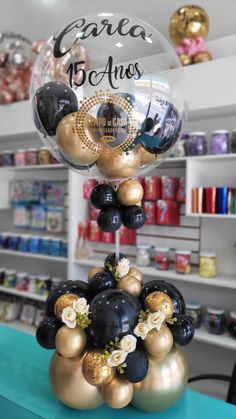 some balloons are stacked on top of each other in front of a store display case