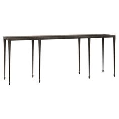 a long table with metal legs and a black finish on the top, against a white background