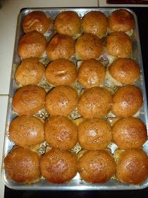 a metal pan filled with rolls on top of a counter