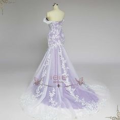 a white and purple wedding dress on a mannequin