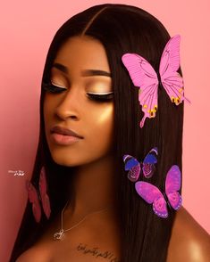 a woman with long black hair and pink butterflies on her head is looking at the camera