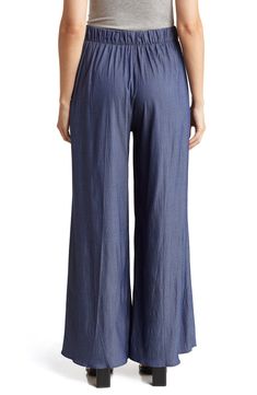 Upgrade your wardrobe with high-waisted pull-on pants constructed from lightweight Tencel® lyocell in a breezy wide-leg silhouette. 30 1/2" inseam; 16" leg opening; 12" front rise; 14" back rise   Back elastic waist   100% Tencel lyocell   Tencel lyocell is a sustainably produced fiber made with closed-loop processing   Machine wash, line dry   Made in the USA of imported fabric   Model stats: 5'10" height, 32" bust, 25" waist, 36" hip. Model is wearing size Small. Summer Vacation Wide Leg Pants With Pull-on Style, Versatile Summer Pull-on Pants, Versatile Summer Pants With Pull-on Style, Summer Versatile Pull-on Pants, Relaxed Fit Wide Leg Pants With Pull-on Style, Chic Viscose Pants For Vacation, Versatile Stretch Wide Leg Pants For Vacation, Casual High-waisted Rayon Pants, Versatile Viscose Bottoms For Spring