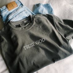 "Trust God; Comfort Colors; Oversized tshirt; Jesus shirt; Christian apparel; Trust God Bro; Motivational Shirt; Bible Verse shirt; Faith Shirt; Christian Shirt, Church Shirt;  Comfort Colors introduces the \"Comfort Colors 1717\" garment-dyed t-shirt; a fully customizable tee made 100% with ring-spun cotton. The soft-washed, garment-dyed fabric brings extra coziness to your wardrobe while the relaxed fit makes it an excellent daily choice. The double-needle stitching throughout the tee makes it Oversized Basic Slogan Tops, Basic Oversized Slogan Top, Oversized Gray Slogan Tops, Oversized Gray Tops With Slogan, Gray Cotton Slogan Top, Gray Oversized Slogan T-shirt, Gray Cotton Slogan T-shirt, Basic Gray Shirt With Letter Print, Oversized Letter Print Shirt For Everyday