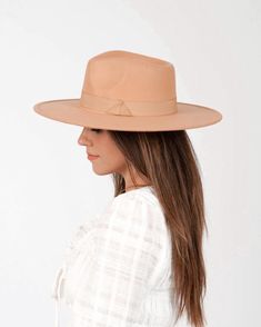 Flat and stiff brim Ariel felt rancher hat in Parchment. This super chic hat can go with quite literally any outfit! Have it be the final touch for a chic and stylish look. Details: 100% polyester Brim: 3.75 in. Crown height: 4 in. Adjustable inner drawstring Spring Flat Brim Felt Hat, Fitted Felt Hat With Flat Crown For Spring, Chic Solid Color Panama Hat With Curved Brim, Chic Fitted Felt Hat With Flat Brim, Trendy Solid Color Hat Band With Curved Brim, Chic Brimmed Panama Hat For Fall, Chic Panama Hat With Flat Crown For Spring, Chic Adjustable Fedora With Flat Crown, Western Style Solid Fedora For Spring