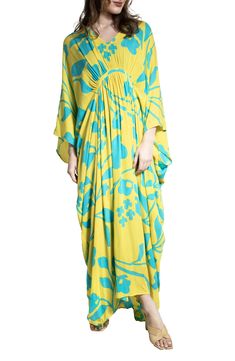 Hit the beach or kick it poolside in this flowy kaftan that features an allover floral pattern, kimono-inspired sleeves and a sharkbite hem. V-neck Kimono-inspired sleeves 100% rayon Hand wash, line dry Imported Floral Print Flowy Maxi Cover-up, Flowy Beach-style Kaftan For Spring, Flowy Beachy Kaftan For Spring, Spring Beachy Flowy Kaftan, Yellow Beachwear Kaftan For The Beach, Spring Maxi Length Pool Dress, Breezy Spring Kaftan, Maxi Length Dress For Pool In Spring, Summer Rayon Flowy Kaftan