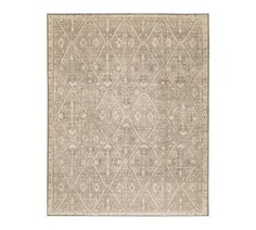 a beige rug with an intricate design on it