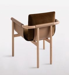 a wooden chair with a brown seat and back cushion on it's armrests