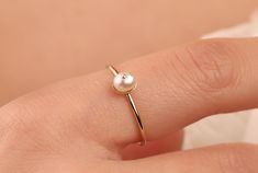 Our dainty pearl ring is 14k solid gold and its available in rose gold and gold. At the top, it has a charming pearl, that accompany you at any time of the day. It is the perfect gift for your partner on special days. Also, it can be used as a wedding ring or bridesmaid ring. Moreover, if you think this dainty pearl ring as a gift, it makes happy your loved ones on their birthdays, mother's day, valentine's day, anniversary, or graduation. If you want, you can add a gift note for your loved ones Minimalist Rose Gold Pearl Ring, Simple Pearl Ring For Wedding, Minimalist Pearl Anniversary Ring, Dainty Rose Gold Pearl Ring For Formal Occasions, Elegant 14k Gold Stackable Pearl Ring, Minimalist 14k Gold Pearl Ring, 14k Gold Dainty Pearl Ring For Formal Occasions, Dainty 14k Gold Pearl Ring For Formal Occasions, Delicate 14k Gold Pearl Promise Ring