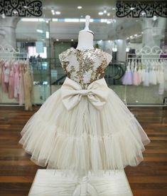 Your girl will look special in this cute dress! Gold and cream colours create an unforgettable elegant look for your princess! Gold Princess Pageant Dress For Dress-up, White Princess Dress With Ruffles For Prom, Cream Ball Gown For Prom, Cream Ball Gown Dress For Prom, Elegant Cream Tutu Dress With Ruffles, Elegant Gold Princess Dress For Party, Elegant Gold Ball Gown For Pageant, Elegant Cream Ball Gown For Party, Elegant Gold Tulle Dress