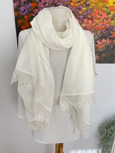 Off white Pashmina Shawl with beautiful lace.  These unique pashmina shawls make the perfect gift and wedding favor for all your lady guests. Also great for bridal Showers, Birthdays and special occasions. Produced in pet and smoke free environment.  Please wash by hand with warm water and soap. No machine dry. Fabric length (except lace) : 70'' x 25'' (1,80m x 65 cm) Material: Polyester , Very Soft and Lightweight. Suitable for all seasons.  EXPRESS Shipping Upgrade for 4+ pieces   Buy at least Crochet Lace Shawl For Wedding, Wedding Lace Shawl Dupatta, Wedding Lace Dupatta Shawl, Lace Dupatta With Lace Trim, Lace Dupatta Shawl For Wedding, Elegant Wedding Dupatta With Lace Trim, Traditional Lace Shawl With Lace Trim, Elegant Shawl Scarf With Lace Trim, Elegant Lace Trim Shawl Scarf