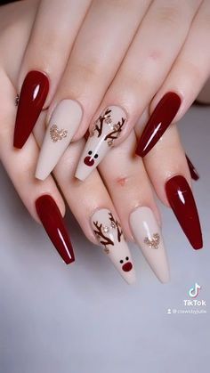 It can be anything, as long as it's holiday-themed! Wine Christmas Nails, Christmas Nail Designs 2023, Reindeer Nails Designs, Xmas Red Nails, Christmas Nails Design Holiday, Christmas Nails Reindeer, Red Xmas Nails, December Nails Red, Reindeer Nail Art