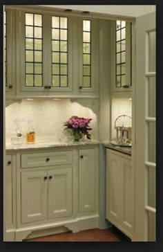 a kitchen that has some cabinets in it