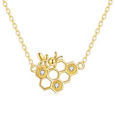 Discover the perfect blend of elegance and charm with our 14K Gold Pendant Necklace, featuring a stunning Cubic Zirconia bee and honeycomb design, perfect for women who want to shine in style. Ideal for any occasion, this exquisitely crafted necklace combines the timeless allure of 14K Gold with the dazzling brilliance of Cubic Zirconia, symbolizing the beauty and strength of the bee and honeycomb motif. Make a statement with a piece thats both sophisticated and unique, reflecting your inner rad Women Gold Pendant, Bee Honeycomb, Honeycomb Design, Bee Pendant, Gold Charm Necklace, 14k Gold Necklace, Gold Necklace Women, The Bee, Gold Pendant Necklace