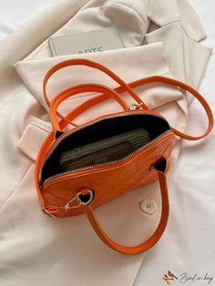 BirdinBag - Chic Geometric Clamshell Bag: Double-Handled with Adjustable Crossbody/Handheld Strap Orange Handheld Bag With Detachable Handle, Orange Satchel With Detachable Handle, Orange Top Handle Satchel With Detachable Handle, Trendy Orange Tote Satchel, Handheld Orange Shoulder Bag With Handles, Orange Crossbody Satchel, Orange Satchel With Detachable Strap For Errands, Trendy Orange Satchel With Detachable Handle, Trendy Orange Shoulder Bag Satchel