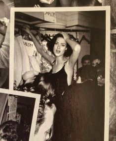 an old black and white photo of a woman with her hair in the air at a party