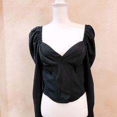 Betty Top Features A Statement Sweetheart Neckline That Leads To A Structured, Corset Bodice. Side Zip Closure Sweetheart Neck Long Puffy Sleeves 93% Polyester, 7% Elastane Sweetheart Neckline Top For Date Night In Spring, Black Tops With Sweetheart Neckline For Party, Long Sleeve Cotton Crop Top For Night Out, Trendy Puff Sleeve Tops For Night Out, Black Party Top With Sweetheart Neckline, Black Sweetheart Neckline Top For Party, Black Balloon Sleeve Top For Party, Chic Cotton Top With Sweetheart Neckline, Fitted Puff Sleeve Tops For Date Night