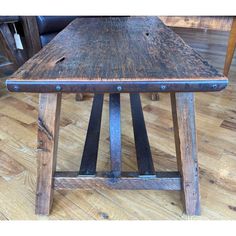 a wooden table sitting on top of a hard wood floor