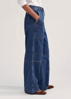 Denim Blue Cargo Pants For Work, Denim Blue Cargo Pants With Pockets For Workwear, Medium Wash Cargo Workwear Bottoms, Utility Bottoms With Cargo Pockets In Recycled Denim, Blue Relaxed Fit Cargo Jeans For Workwear, High Rise Blue Cargo Jeans For Workwear, Dark Wash Cargo Jeans With Patch Pockets For Work, Blue High Rise Cargo Jeans For Workwear, Utility Workwear Jeans In Recycled Denim