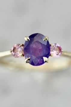 CROWD PLEASER PURPLE OVAL CUT OPALESCENT SAPPHIRE RING | at Gem Breakfast Opalescent Sapphire, It Crowd, Pink Round, Claw Prong, Crowd Pleaser, Oval Cut, Round Brilliant, Sapphire Ring, That Look