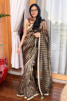 Multicolored saree with black and golden, silver contrast stripes and crochet lace border.
Component: 1
Fabric: Chanderi
Color: Multi Color
Note: Blouse worn by the model is not for sale - Aza Fashions Elegant Cotton Silk Pre-draped Saree With Border, Elegant Pre-draped Saree For Navratri With Border, Bollywood Style Gold Pre-draped Saree With Border, Designer Cotton Silk Pre-draped Saree With Border, Black Self-design Pre-draped Saree For Celebration, Black Pre-draped Saree For Celebration, Black Pre-draped Celebration Saree, Elegant Black Saree With Border, Gold Chanderi Pre-draped Saree With Border