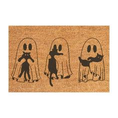 halloween door mat with three ghost silhouettes