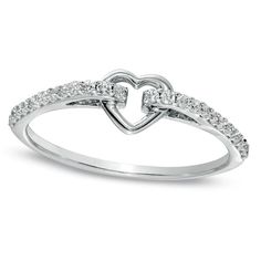 Declare your everlasting love and commitment with this stunning 1/6 CT. T.W. Diamond Heart Promise Ring in 10K White Gold. Tastefully designed, this promise ring showcases a dazzling open heart motif that signifies the enduring bond between you and your partner. The ring is crafted in lustrous 10K white gold and the heart is beautifully surrounded by a sparkling diamond-encrusted shank. This exquisite piece boasts of 1/6 ct. t.w. of radiant diamonds that add a touch of glamour and shine to the ring. Polished to a flawless finish, this ring is the perfect way to show your beloved how much you cherish her. It is a gift that she will treasure for an eternity.The perfect complement to any elegant style, this ring will be hand-made exclusively to your order by our skilled jewelers. Please allow Cute Promise Rings, Gold Infinity Ring, Rings Pandora, Gold Knot Ring, Hammered Gold Ring, Heart Promise Rings, Love Knot Ring, Green Amethyst Ring, Diamond Engagement Rings Vintage