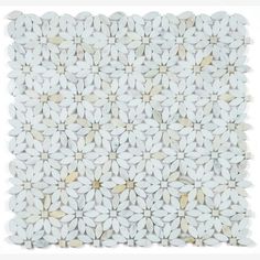 a white tile with flowers on it