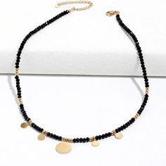 This one-of-a-kind Tori Black Beaded Necklace is sure to catch eyes with its bold mix of edgy black and glitzy gold. A shimmering statement piece for daring fashionistas, it'll add a modern touch to any look! #stylegameonpoint Size: 16 inches with 2 inch extender Materials: Stainless Steel 18K Gold Plated Metal Beaded Necklaces With Round Beads For Party, Trendy Metal Beaded Choker Necklace, Trendy Beaded Metal Necklaces, Trendy Metal Beaded Necklace, Trendy Metal Beaded Necklaces, Gold Necklaces With Black Beads For Party, Party Beaded Necklace With Metal Beads, Party Beaded Chain Necklace With Metal Beads, Chic Beaded Necklace For Party