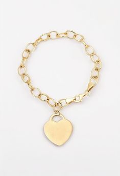 Lovely links of 10K yellow gold dangle a heart pendant in this romantic bracelet for her. The 7.5-inch bracelet is secured with a lobster clasp. Elegant Gold Charm Bracelet With Heart Charm, Elegant Heart Shaped Tarnish Resistant Charm Bracelet, Elegant Heart-shaped Tarnish-resistant Charm Bracelet, Classic Gold Charm Bracelet With Heart, Gold Heart Charm Bracelet Classic Style, Classic Yellow Gold Heart Charm Bracelet, Elegant Gold Heart Bracelet With Charms, Elegant Yellow Gold Heart Bracelet With Charms, Elegant Valentine's Day Heart Bracelet With Charms