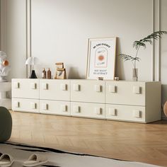 a living room with white furniture and wooden floors