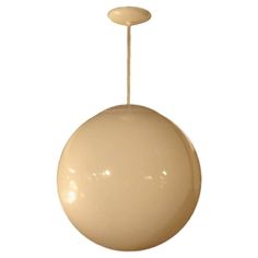 a white light hanging from the ceiling with a round ball on it's end