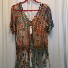 Brand: It Girl Item: Crochet Fringe Trim Hem Top Size: S Color: Multicolor Front/Natural Back Condition: New W/Tag Remarks: Short Sleeve; Acrylic/Polyester Blend; Delicate Wash.Bin#3 I Only Offer Clean, Undamaged Merchandise As Stated In Each Description. Shipments Are Packed And Moving To You Generally Within 24 Hours Of Payment, Sometimes The Same Day! I Utilize The Cheapest Shipping Manner Possible To Save You Even More. Finally, Thank You For Stopping By. Orange Bohemian V-neck Top, Hippie Multicolor Summer Cover-up, Multicolor Hippie Summer Cover-up, Beachwear Tops With Crochet Trim For Festivals, Multicolor Crochet Top For Spring Beach Cover-up, Orange V-neck Top For Festivals, Multicolor Short Sleeve Cover-up For Festival, Orange Crochet Beach Top For Spring, Multicolor Short Sleeve Festival Cover-up