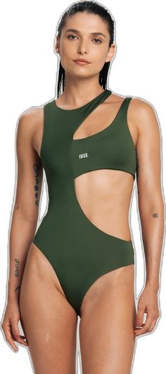 a woman in a green one piece swimsuit with cutouts on the back and sides