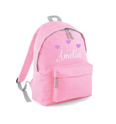 Kids Backpack personalised with the name of your choice. The perfect size for nursery, pre-school and primary school (age guide 3-10).  We also sell a smaller bag for younger children. Please visit our shop for details. Dimensions: 38 x 28 x 19 cm. The bag includes: grab handle, padded adjustable shoulder straps, padded back panel, main zip compartment and front zip pocket Please contact us if you have any questions. We also have a number of other personalised gifts in our shop, so why not take a look around: https://www.etsy.com/uk/shop/NorabellaUK Click here to read our policies: https://www.etsy.com/uk/shop/NorabellaUK#policies Customizable Pink Backpack For Students, Personalized Pink Backpack For Back To School, Customizable Pink Backpack For School Events, Cute Personalized Bags For School Events, Personalized Softback School Bag, Personalized Pink Standard Backpack, Customizable Pink Bags For Students, Pink Backpack For School Events, Personalized Standard Backpack For School