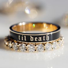 A piece to honor those in your life whose love lasts forever, the Til Death band is perfect for stacking or wearing solo. Due to the width of this band, we recommend sizing a half size up, especially when stacking. This piece is part of our Til Death collection. Shop the collection here. Available in 18k gold Contact us for pricing. Gym Wedding Ring, Black And Gold Wedding Dresses, Black And Gold Wedding Rings, 3 Stacked Wedding Rings, Black And Gold Wedding Dress, Black And Gold Wedding Band, Black Aesthetic Wedding, Goth Wedding Rings, Stackable Engagement Rings