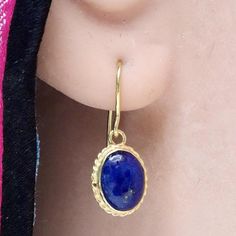 Valued by the Egyptians as a talismanlapis lazuli is still a favorite gem today. These stones are set in a14k gold setting withfiligree edge and feature french hooksfor pierced ears. Size: 3/4 inch. Elegant Lapis Lazuli Oval Cabochon Jewelry, Gold Oval Lapis Lazuli Jewelry, Oval Gold Lapis Lazuli Jewelry, Elegant Oval Cabochon Lapis Lazuli Jewelry, Traditional Gold Lapis Lazuli Jewelry, Traditional Gold Jewelry With Lapis Lazuli, Gold Lapis Lazuli Jewelry With Cabochon, Yellow Gold Lapis Lazuli Cabochon Jewelry, Classic Lapis Lazuli Yellow Gold Jewelry